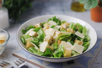 A bowl with classic Caesar salad