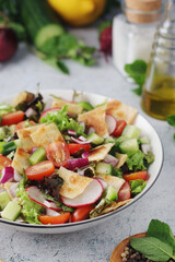 A bowl with Fattoush - Traditional Levantine salad