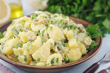 A bowl with Greek potato salads