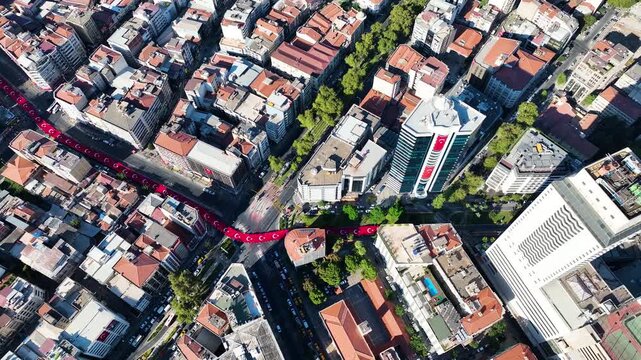 People carrying the Turkish flag for the national holiday celebration in Izmir - 4K video of the large Turkish flag and people carrying it, taken by drone, Izmir-Turkey and the celebration cortege