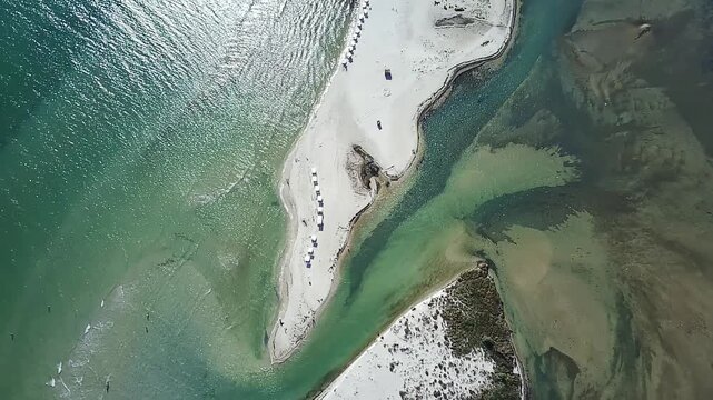 Sandy Spit Surrounded by Turquoise Waters.