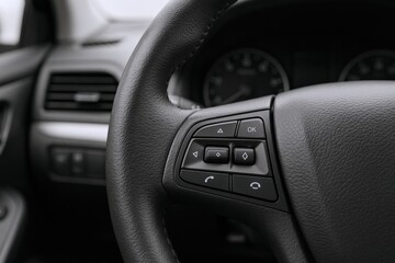 Close-up of Modern Vehicle Steering Wheel with Integrated Controls for Safety and Connectivity