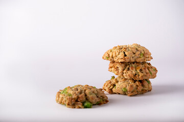 homemade oatmeal cookies with lime on white background, copy space
