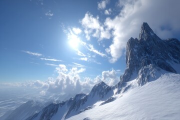 Snow-covered mountain peaks rise sharply under a bright blue sky with scattered clouds and sunlight