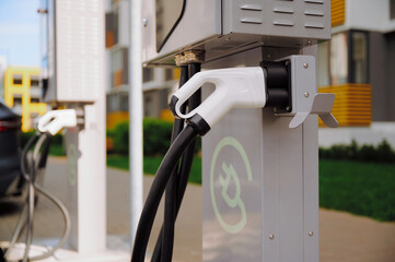 Electric vehicle charging station outside apartment building