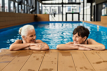 Joyful moments of two beautiful mature women enjoying their time at a wellness center