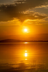 Bright, colorful summer sunset over Lake Mitkow in Poland. Evening landscape.