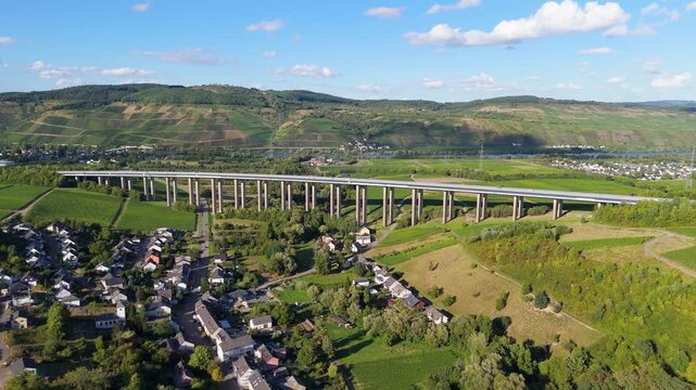 Moselle Viaduct Longuich, vineyard in Mosel valley, bridge of highway crossing river near Trier, german autobahn, aerial view