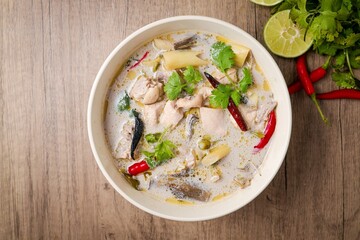 Tom kha gai ,Thai chicken coconut milk soup on white bowl ,top view ,It is Thai food, curry with coconut milk.	
