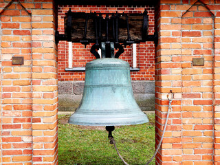 Obraz premium Antique Bell in Brick Structure