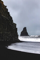 Balast columns on black sand beach in Iceland