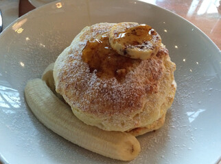 Fluffy Pancakes with Banana and Syrup