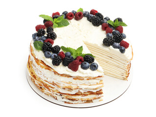 Tasty crepe cake with berries and mint isolated on white