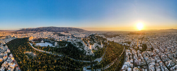 Aerial landscape from ancient Lycabettus Hill monument winter sunset Mediterranean Athens