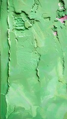 Abstract green textured surface with cracks and irregularities