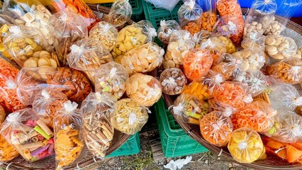 Assorted Thai Snacks in Plastic Bags at Local Market, Thai food in the market 