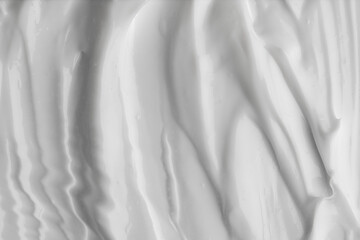 Obraz premium Glossy moisturizing cream with soft flowing folds, hydrating cream texture with smooth glossy streaks