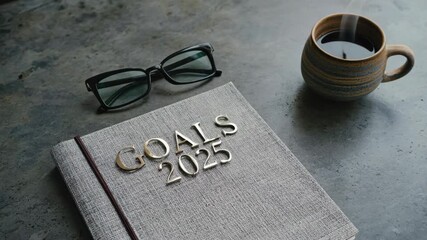 Personalized journal for daily goals, with book, coffee mug, sunglasses, and pen.