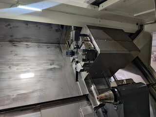 Close-Up of CNC Lathe Cutting Tool on Turret for Metalworking and Precision Engineering