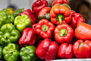 red and yellow peppers, Pile of fresh green and red bell peppers, close-up