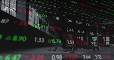 Performing push-ups, fitness duo in workout gear training in warehouse gym with market data overlay