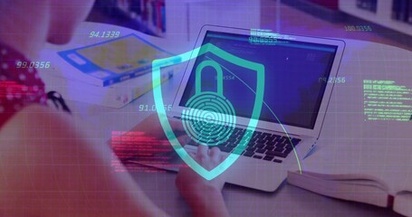 Teenage female in red dotted top studying code on laptop in library, with digital security overlay