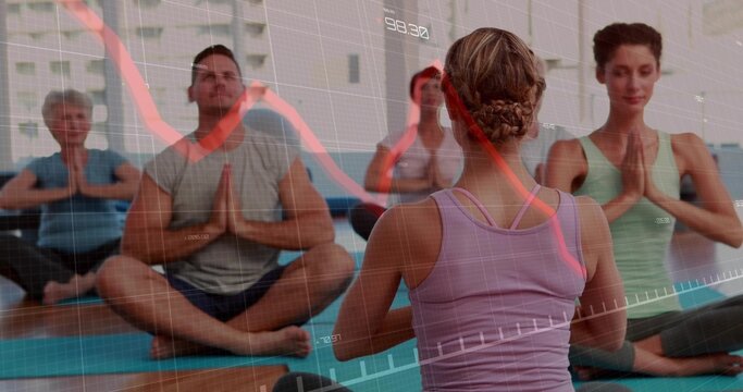 Leading instructor wearing tank top guiding students on yoga mats in studio, with financial overlay