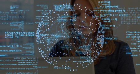 Working software developer coding on laptop in workspace, with blue code data visualization network