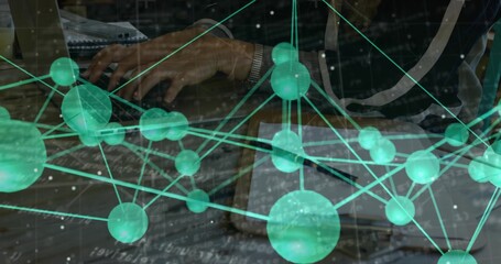 Typing businesswoman in dark jacket at office desk, with laptop notebook wristwatch network overlay