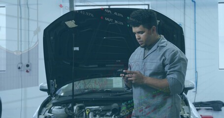 Mechanic wearing gray coverall checking data on smartphone beside open-hood sedan in workshop bay