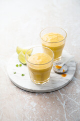 Fototapeta premium Healthy mango lassi with turmeric