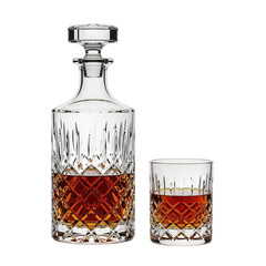 Elegant crystal decanter and tumbler filled with amber whiskey isolated on transparent background