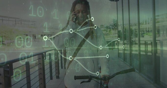 Walking man pushing bicycle along path by glass facade, holding smartphone amid binary code overlay