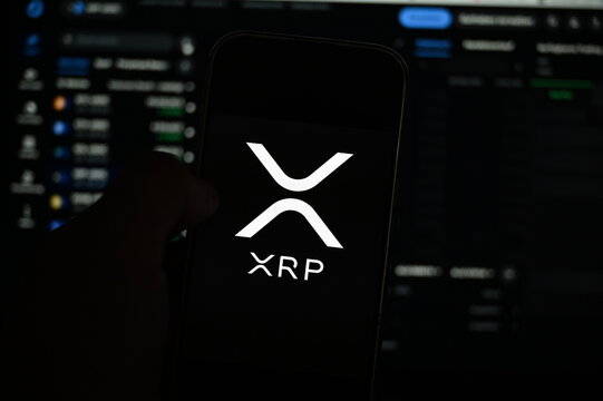 Germany - September 12,2025: XRP Coin logo on phone