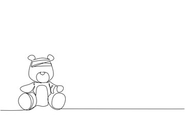 Continuous line drawing of a teddy bear with head bandage, symbolizing broken childhood and innocence, used as a psychology concept for International Day of Innocent Children Victims of Aggression.