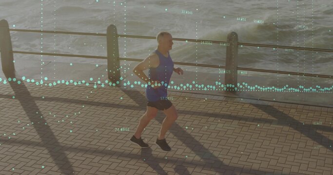 Jogging senior runner in sportswear on paved promenade by railing and water, showing data overlay