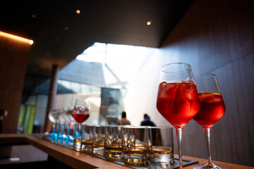 Refreshing colorful cocktails served in glasses with straws, festive summer party drinks on catering table at celebration or holiday event