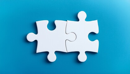 two white puzzle pieces matching together againt light blue background