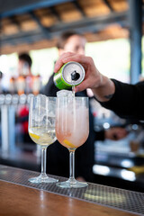 Refreshing colorful cocktails served in glasses with straws, festive summer party drinks on catering table at celebration or holiday event