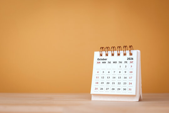 Calendar page October of the year 2026 on orange background. with copy space and business design. Concept of monthly planning, important schedules, meetings, and appointments.