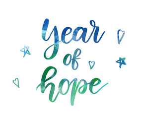 A watercolor text with 'Year of Hope' and small decorative stars and hearts. New Year holiday concept. Handwritten modern calligraphy text