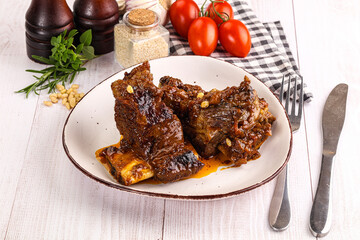 Prepared tasty beef ribs with sauce