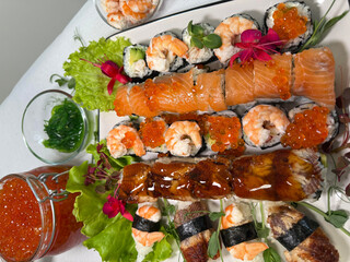 decorate the plate with ears with microgreens, edible flowers and red caviar