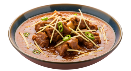 Hearty and flavorful meat curry garnished with fresh ginger and chili peppers, a delicious culinary delight.