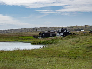 Fototapeta premium fields and lake in Iceland