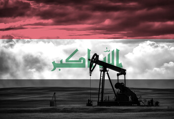 Drilling for oil in the countryside with Iraq national flag overlay