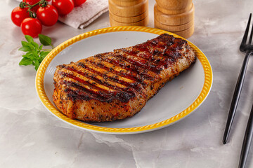 Grilled pork steak with bone