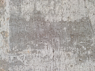 Close up of old concrete wall with stains scratches and weathered texture