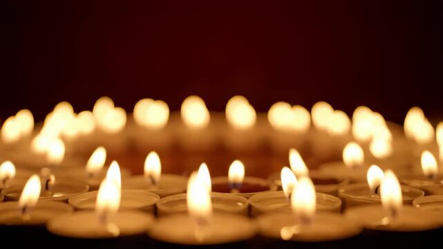 Candle flame field with soft focus and kinetic warmth