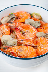 angle view fresh seafood rice noodles with shrimps and oysters at vertical composition